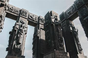Thumbnail of carved Chronicle of Georgia pillars seen from below